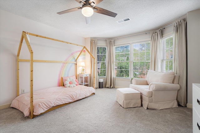 bedroom with visible vents, carpet floors, and multiple windows