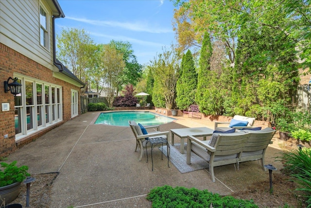 view of swimming pool featuring a fenced backyard, a patio area, and a fenced in pool