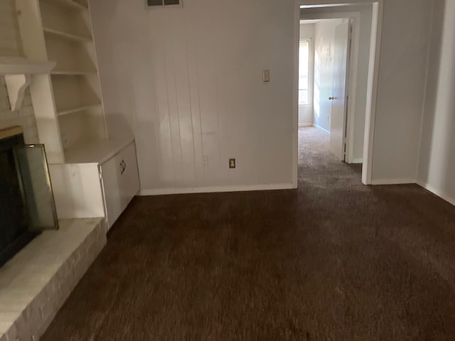 4149 Meadow Creek Rd, Memphis, TN 38115 - unfurnished living room featuring visible vents, baseboards, and dark carpet