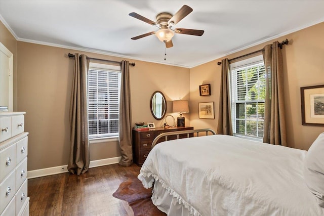 bedroom with ornamental molding, baseboards, dark wood-style flooring, and ceiling fan