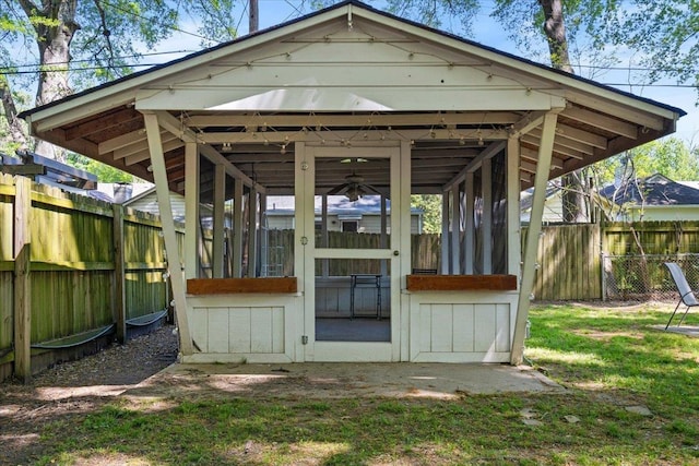 view of outbuilding featuring a fenced backyard