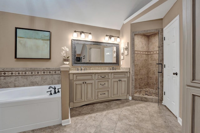 full bathroom featuring tile patterned floors, a stall shower, and a sink