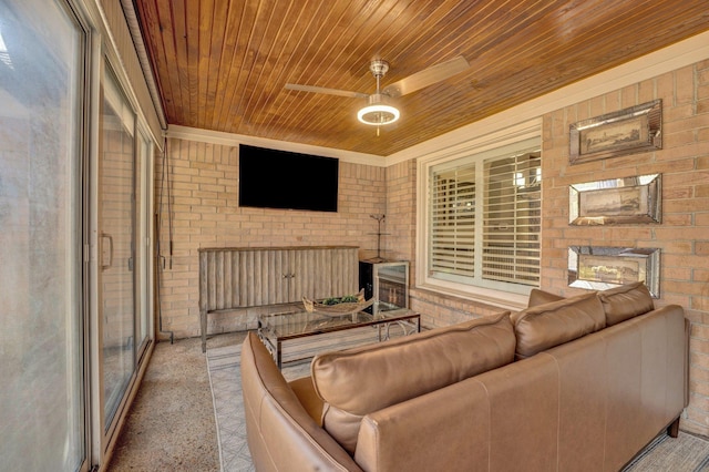 living room featuring brick wall, wooden ceiling, and a ceiling fan
