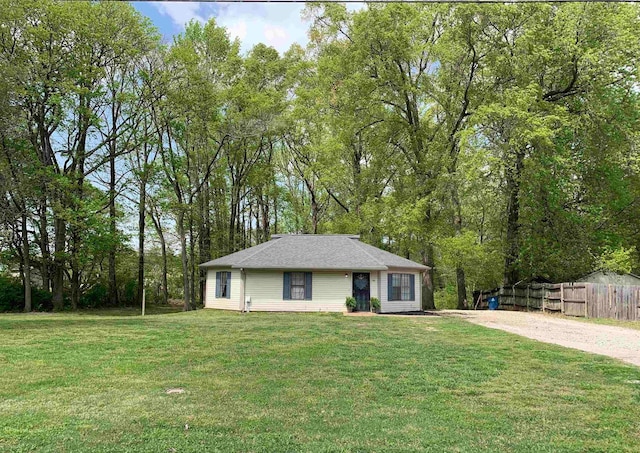96 Sharon St, Atoka, TN 38004 - single story home with dirt driveway, a front lawn, and fence