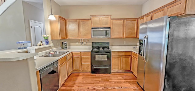 62 Mabel Ln, Atoka, TN 38004 - kitchen with black appliances, light wood-style flooring, a sink, light countertops, and light brown cabinetry