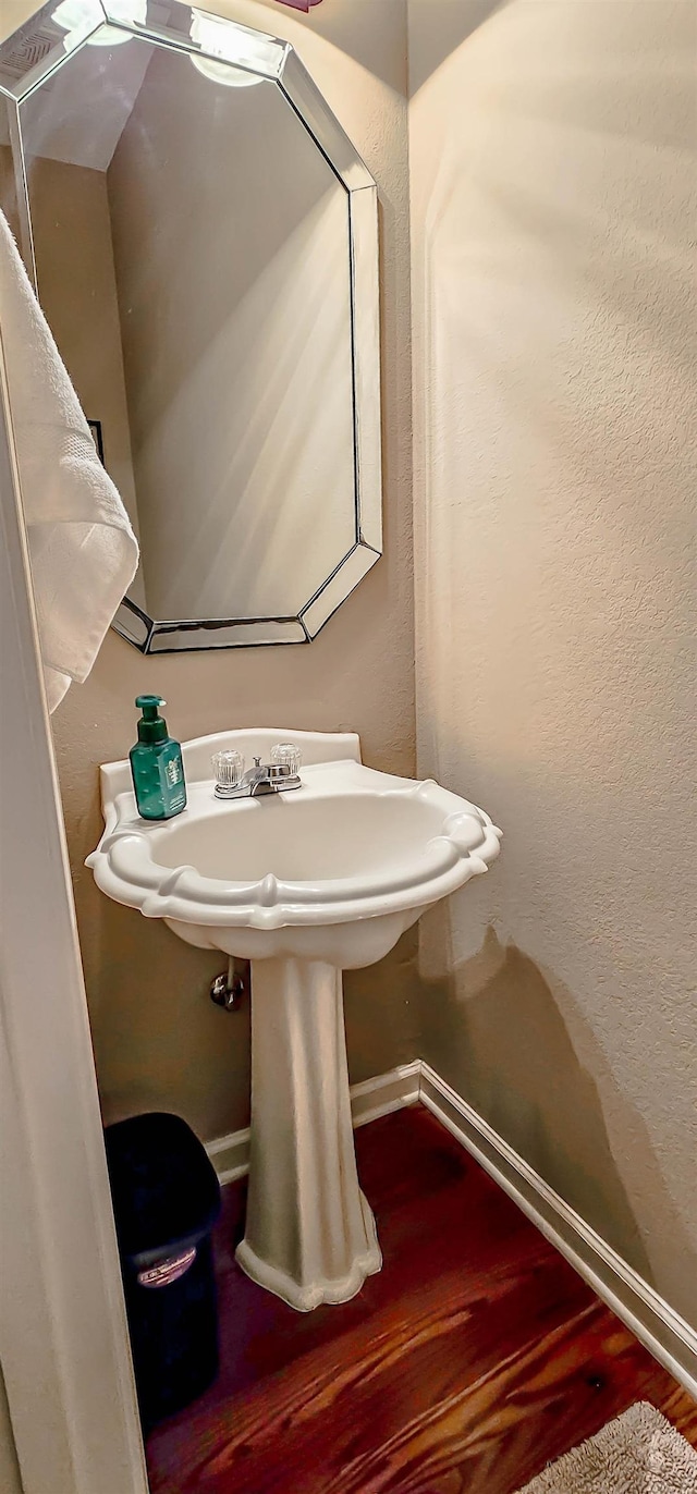 62 Mabel Ln, Atoka, TN 38004 - bathroom with baseboards and wood finished floors