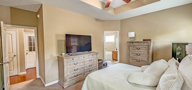 62 Mabel Ln, Atoka, TN 38004 - bedroom featuring baseboards, ensuite bath, light carpet, and ceiling fan