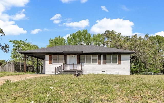 36 W Emory Rd, Memphis, TN 38109 - view of front of home with fence, crawl space, driveway, an attached carport, and brick siding