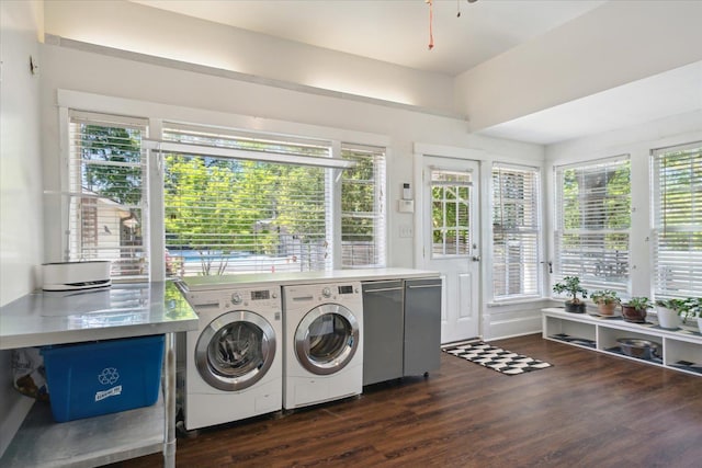 clothes washing area with independent washer and dryer, dark wood-style flooring, and laundry area
