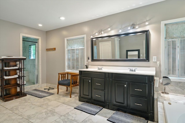 full bath featuring marble finish floor, a sink, a shower, and double vanity