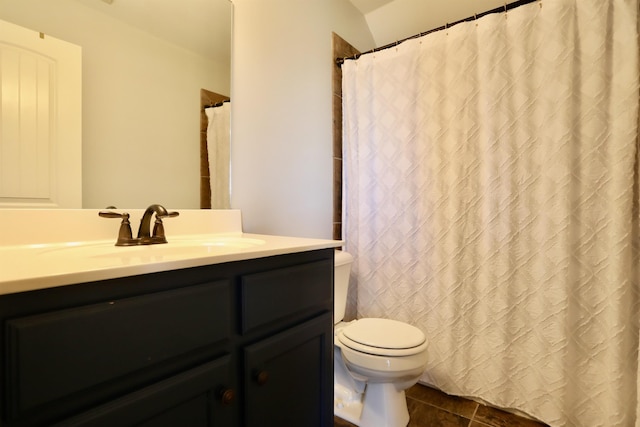bathroom featuring tile patterned floors, vanity, and toilet
