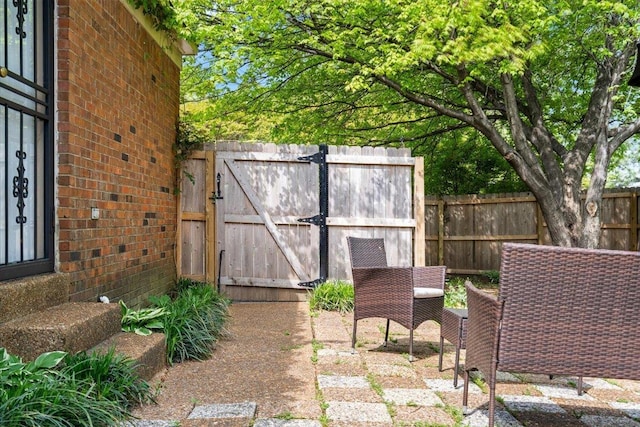 exterior space featuring a gate and fence