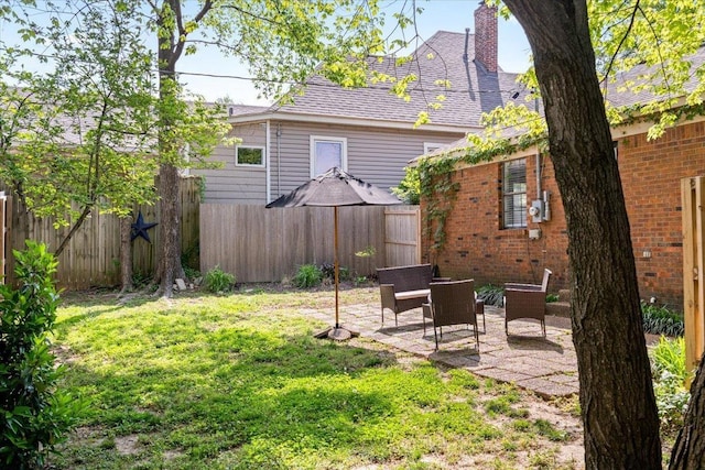 view of yard featuring a patio area and fence