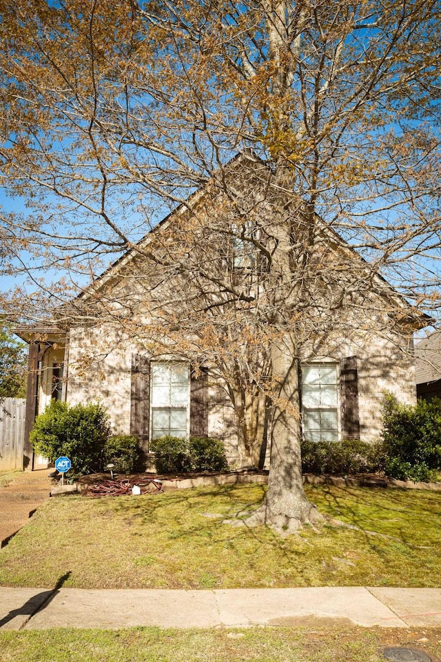 view of front of home with fence