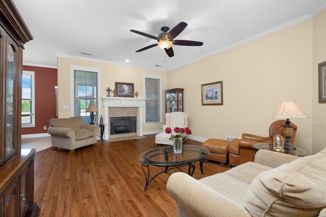 325 Fairoaks Dr, Oakland, TN 38060 - living room with a fireplace with flush hearth, baseboards, wood finished floors, and crown molding