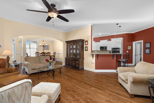 325 Fairoaks Dr, Oakland, TN 38060 - living area featuring arched walkways, ornamental molding, and wood finished floors