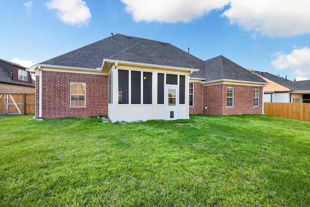 325 Fairoaks Dr, Oakland, TN 38060 - rear view of house featuring a lawn, a fenced backyard, and brick siding