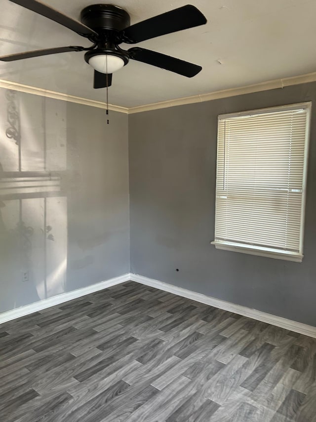 1655 Orleans St S, Memphis, TN 38106 - empty room featuring crown molding, baseboards, a ceiling fan, and dark wood-style floors