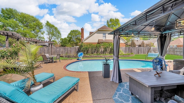 view of swimming pool featuring a fenced in pool, a fenced backyard, a gazebo, outdoor dining area, and a patio
