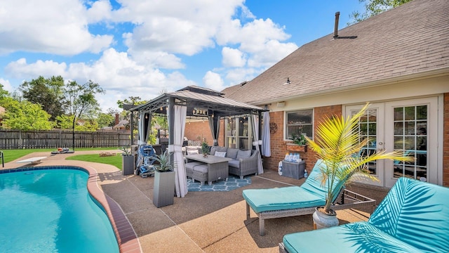 view of swimming pool featuring a gazebo, an outdoor living space, fence, a fenced in pool, and a patio