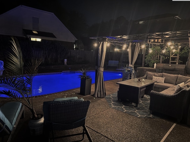 pool at twilight with a fenced backyard, an outdoor hangout area, a fenced in pool, and a patio