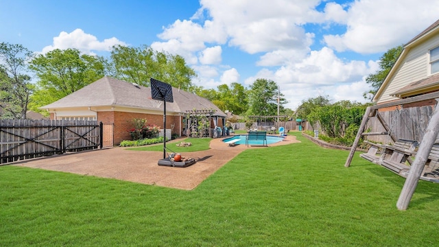 view of yard with a fenced backyard, a gate, a patio, and a fenced in pool