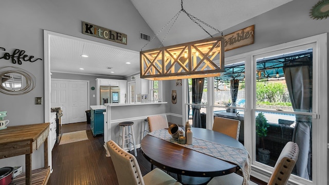 dining room with dark wood-style floors, vaulted ceiling, visible vents, and recessed lighting