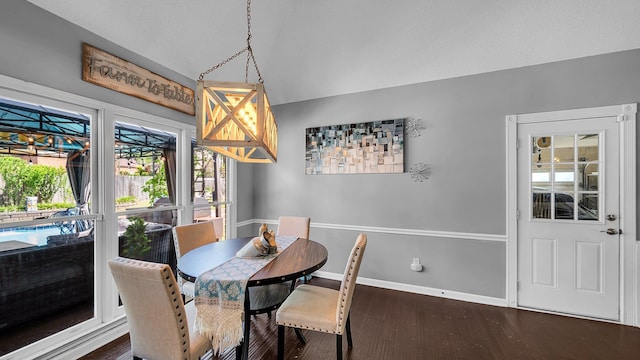 dining room featuring baseboards and dark wood-style flooring