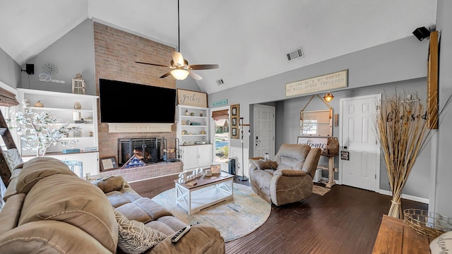 living room with visible vents, a brick fireplace, high vaulted ceiling, and ceiling fan