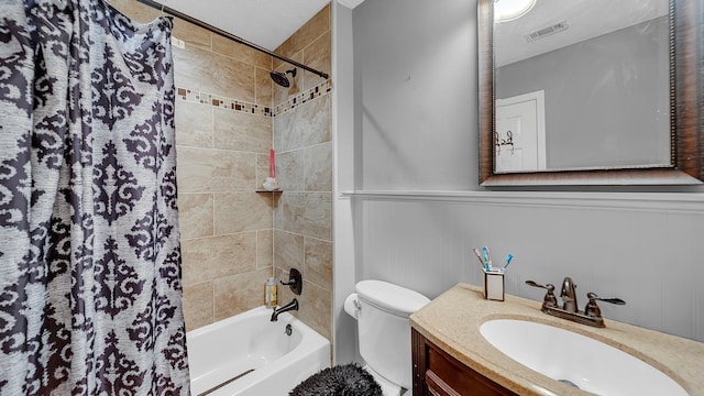 full bathroom featuring shower / bath combo with shower curtain, visible vents, vanity, and toilet