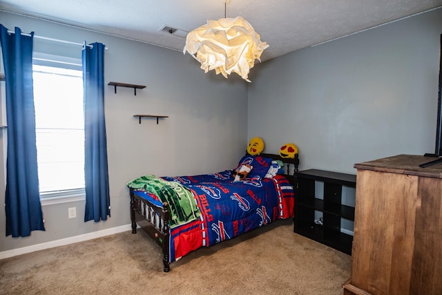 bedroom featuring carpet, visible vents, and baseboards