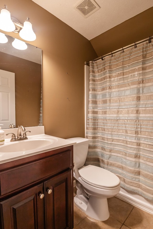 bathroom with tile patterned floors, toilet, visible vents, a shower with shower curtain, and vanity