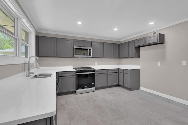 5188 Gwynne Rd, Memphis, TN 38117 - kitchen featuring recessed lighting, range with gas cooktop, a sink, stainless steel microwave, and gray cabinetry
