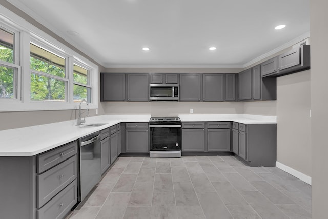 5188 Gwynne Rd, Memphis, TN 38117 - kitchen featuring recessed lighting, gray cabinets, a sink, crown molding, and appliances with stainless steel finishes