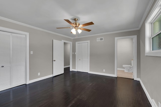 5188 Gwynne Rd, Memphis, TN 38117 - unfurnished bedroom featuring baseboards, ornamental molding, dark wood-type flooring, and visible vents