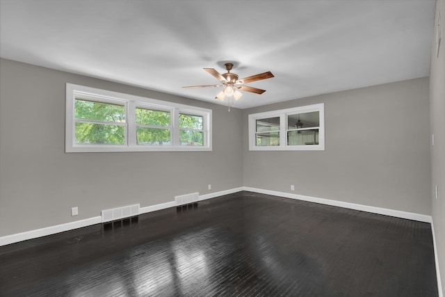 5188 Gwynne Rd, Memphis, TN 38117 - spare room featuring baseboards, a ceiling fan, dark wood-style flooring, and visible vents