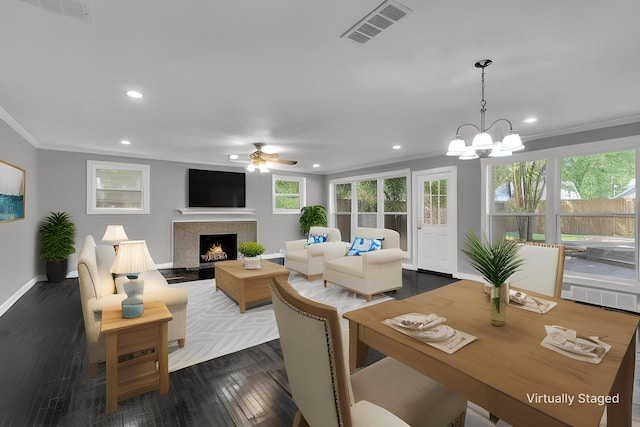 5188 Gwynne Rd, Memphis, TN 38117 - interior space featuring visible vents, recessed lighting, ceiling fan with notable chandelier, crown molding, and dark wood-type flooring