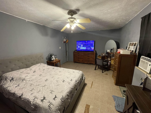 bedroom with a textured ceiling, ceiling fan, and light floors