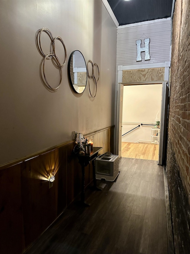 132 W Court Ave, Selmer, TN 38375 - corridor featuring wood finished floors and a wainscoted wall