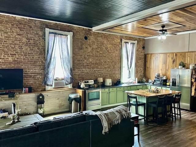 132 W Court Ave, Selmer, TN 38375 - living area with cooling unit, wood ceiling, ceiling fan, brick wall, and dark wood finished floors