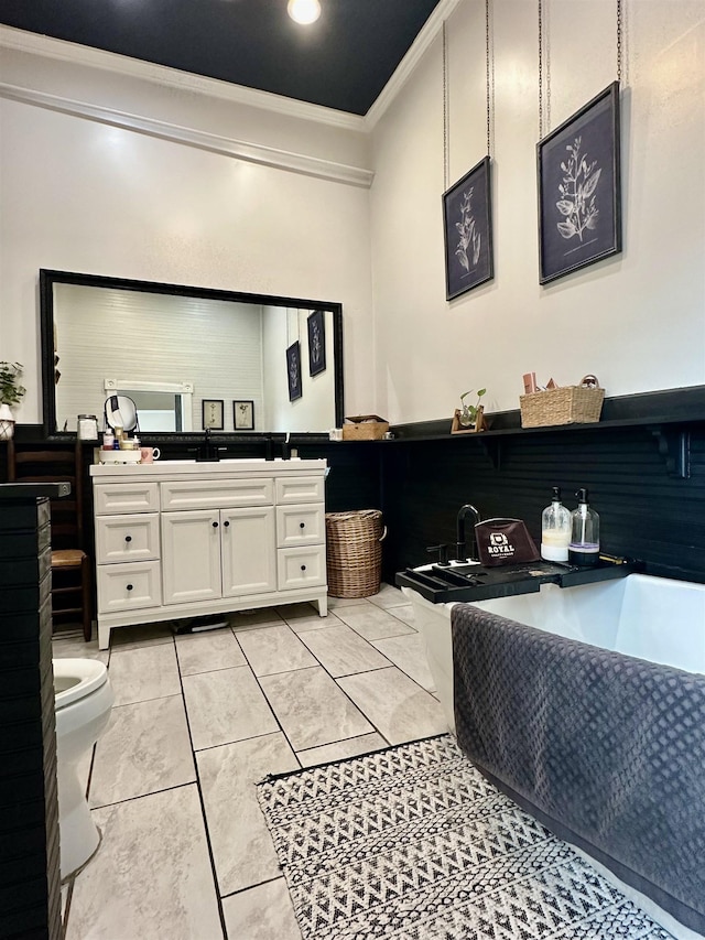 132 W Court Ave, Selmer, TN 38375 - bathroom featuring toilet, vanity, ornamental molding, and a freestanding bath