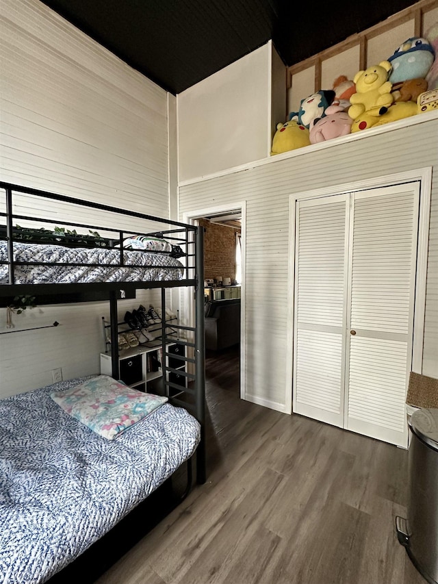 132 W Court Ave, Selmer, TN 38375 - bedroom with wood finished floors, a high ceiling, and a closet