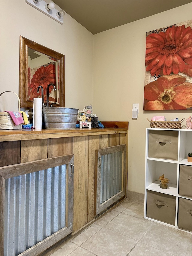 132 W Court Ave, Selmer, TN 38375 - interior space with tile patterned floors and a sink