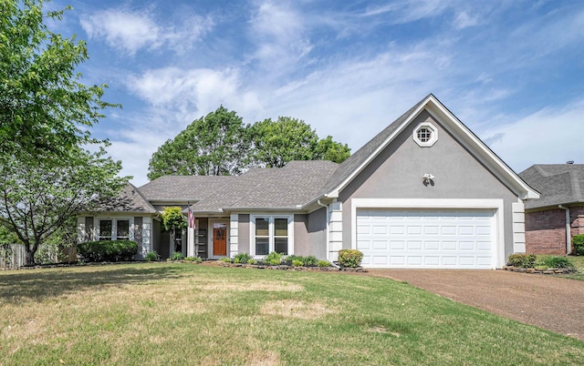 ranch-style home with stucco siding, an attached garage, a front yard, and aphalt driveway