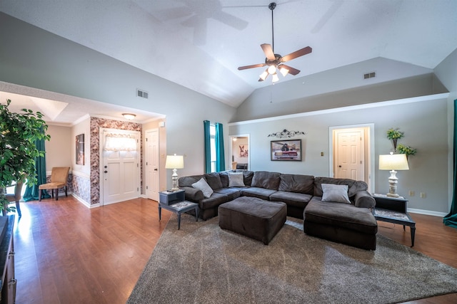 living room featuring ceiling fan, baseboards, wood finished floors, and visible vents