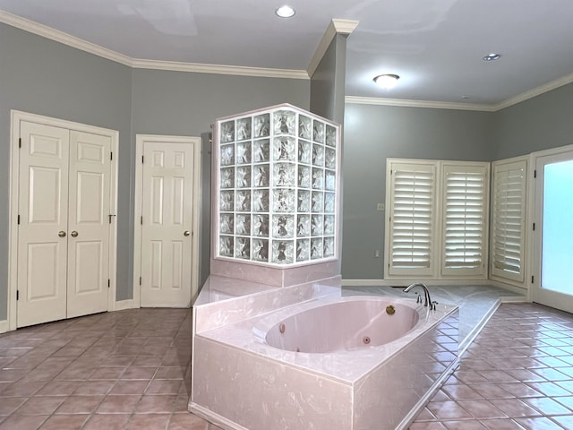 bathroom with crown molding, tile patterned flooring, and a whirlpool tub