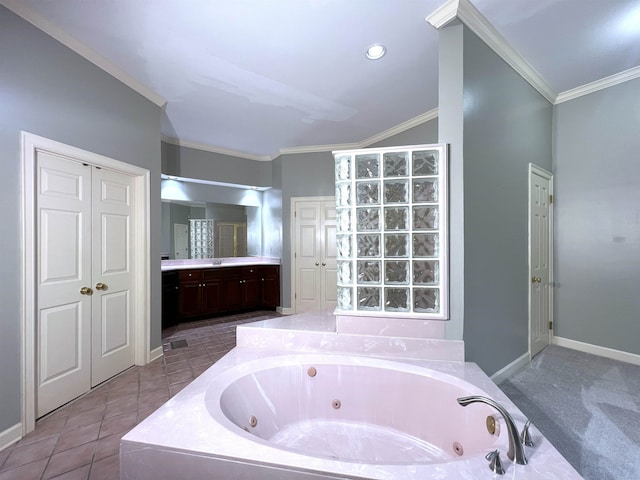 full bath featuring a whirlpool tub, ornamental molding, baseboards, and vanity