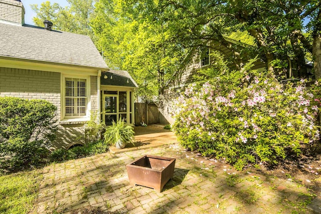 view of yard with a patio and fence