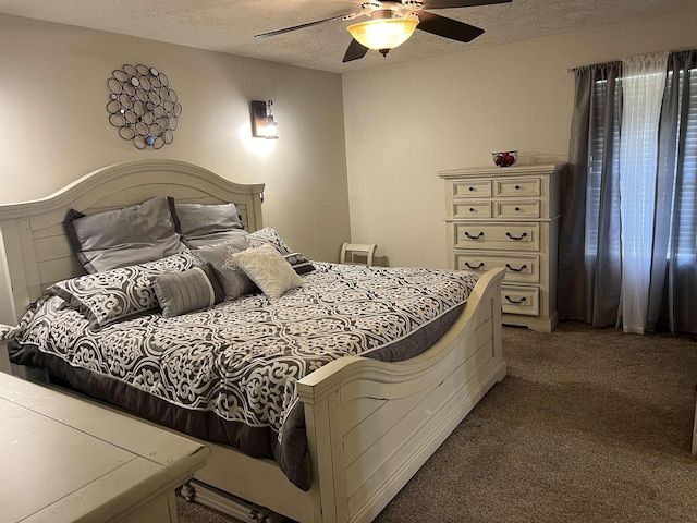 bedroom with carpet floors, a textured ceiling, and ceiling fan