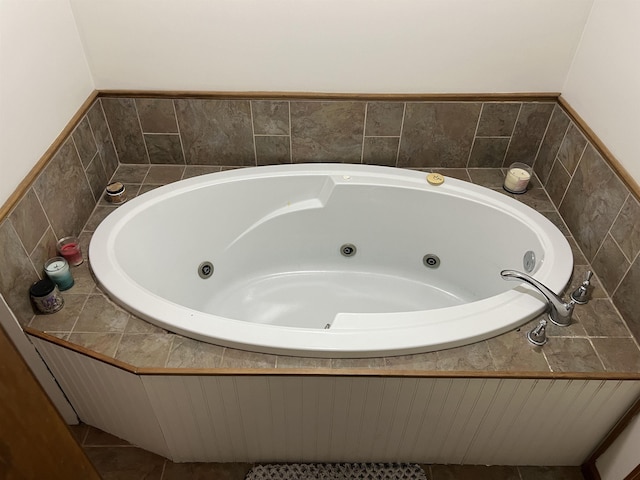 full bathroom with a whirlpool tub